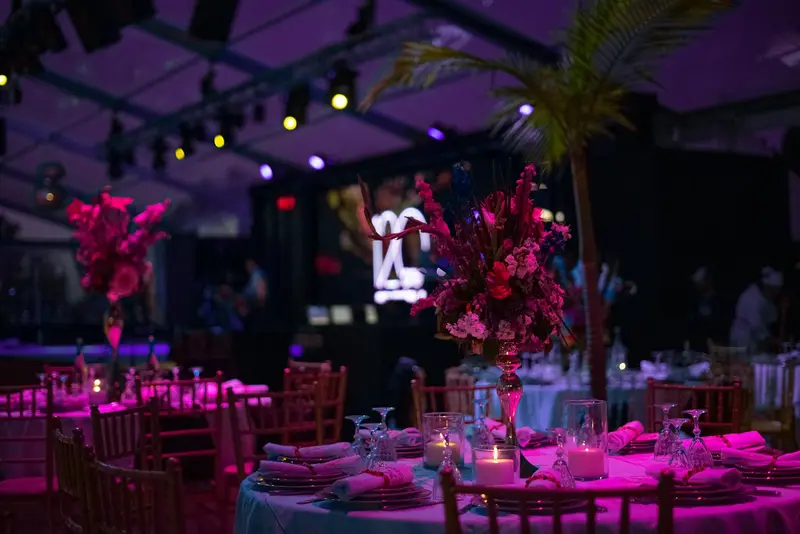 A long event table set with candles and flowers