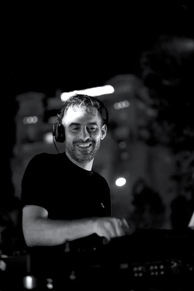 Driguo mixing at night, photographed in black and white