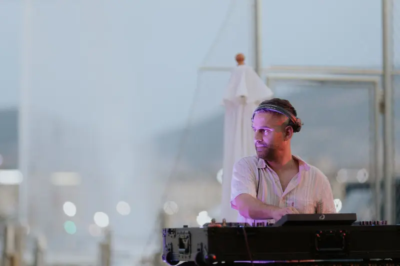 Driguo playing a daytime set beside the marina