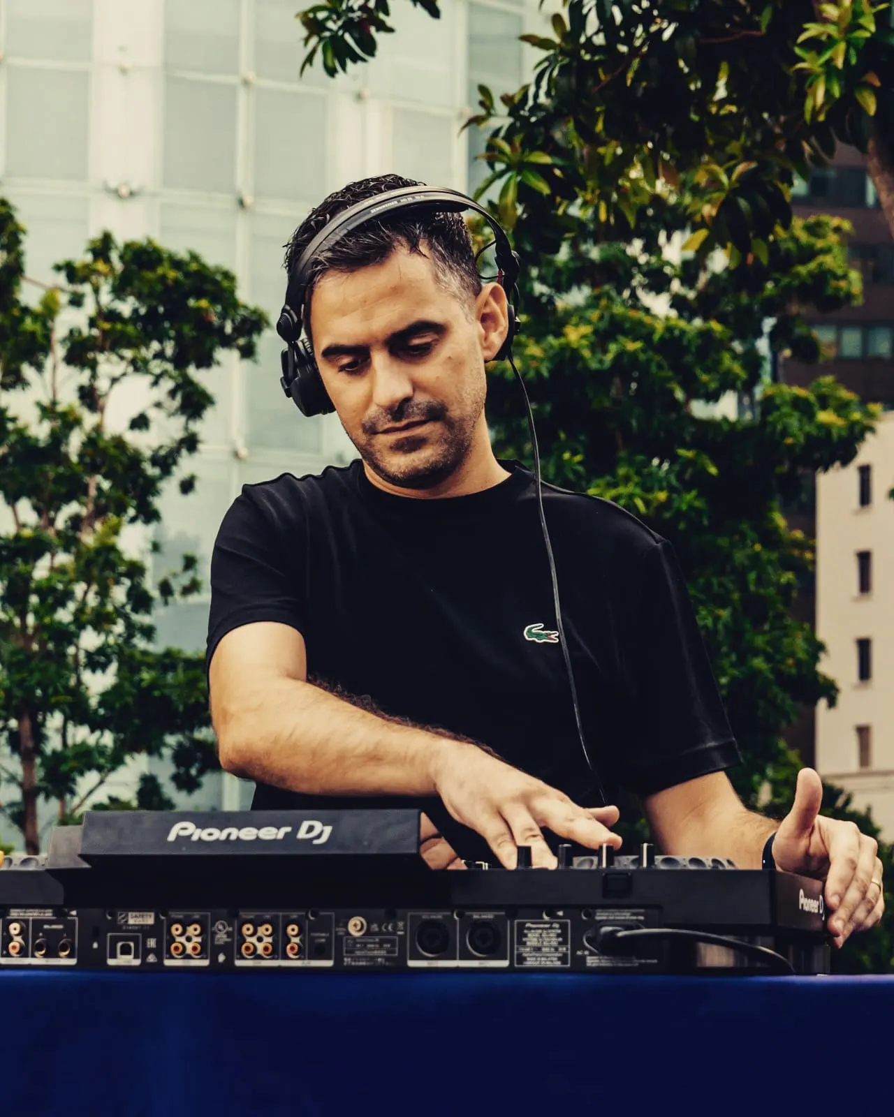 Driguo at Pioneer decks on a leafy rooftop terrace